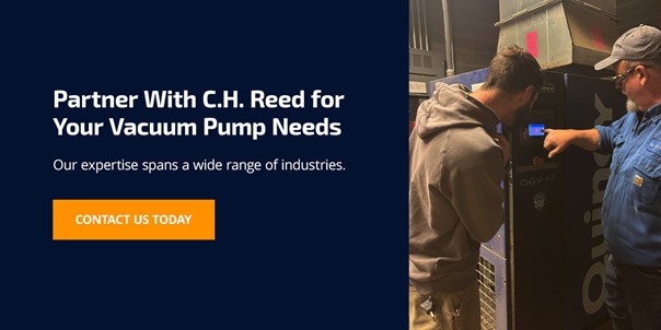 C.H. Reed team inspecting a vacuum pump in an industrial facility, promoting expert service and support.