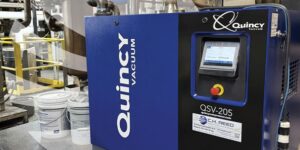 Blue Quincy QSV-205 vacuum pump used for industrial applications with integrated control interface.